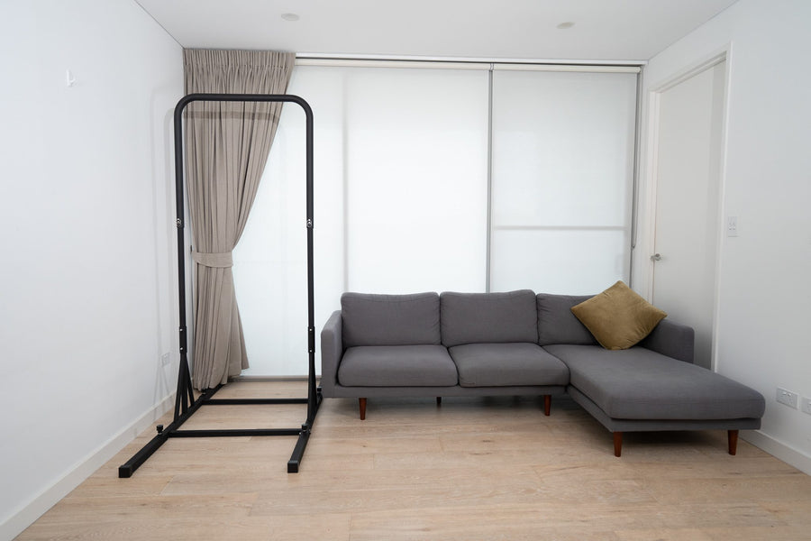 BaseBlocks pull-up bar beside a sofa